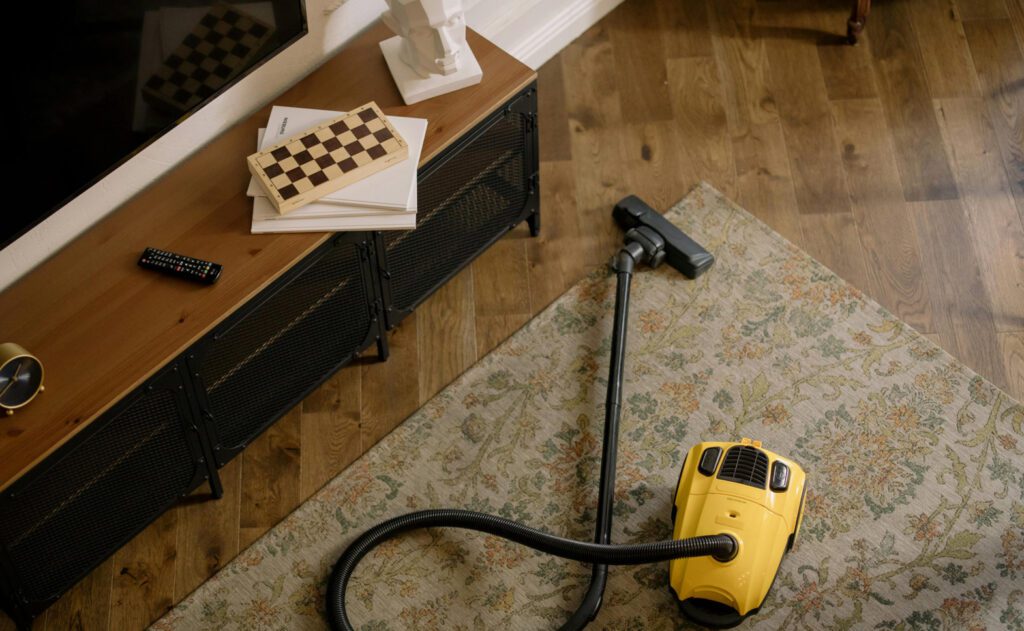 Cleaner wiping window glass with cloth