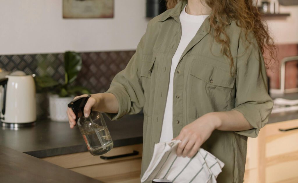 Janitor cleaning hardwood floor in commercial building